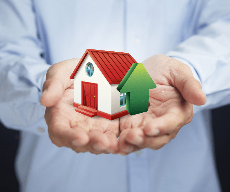 man holding small house in hands